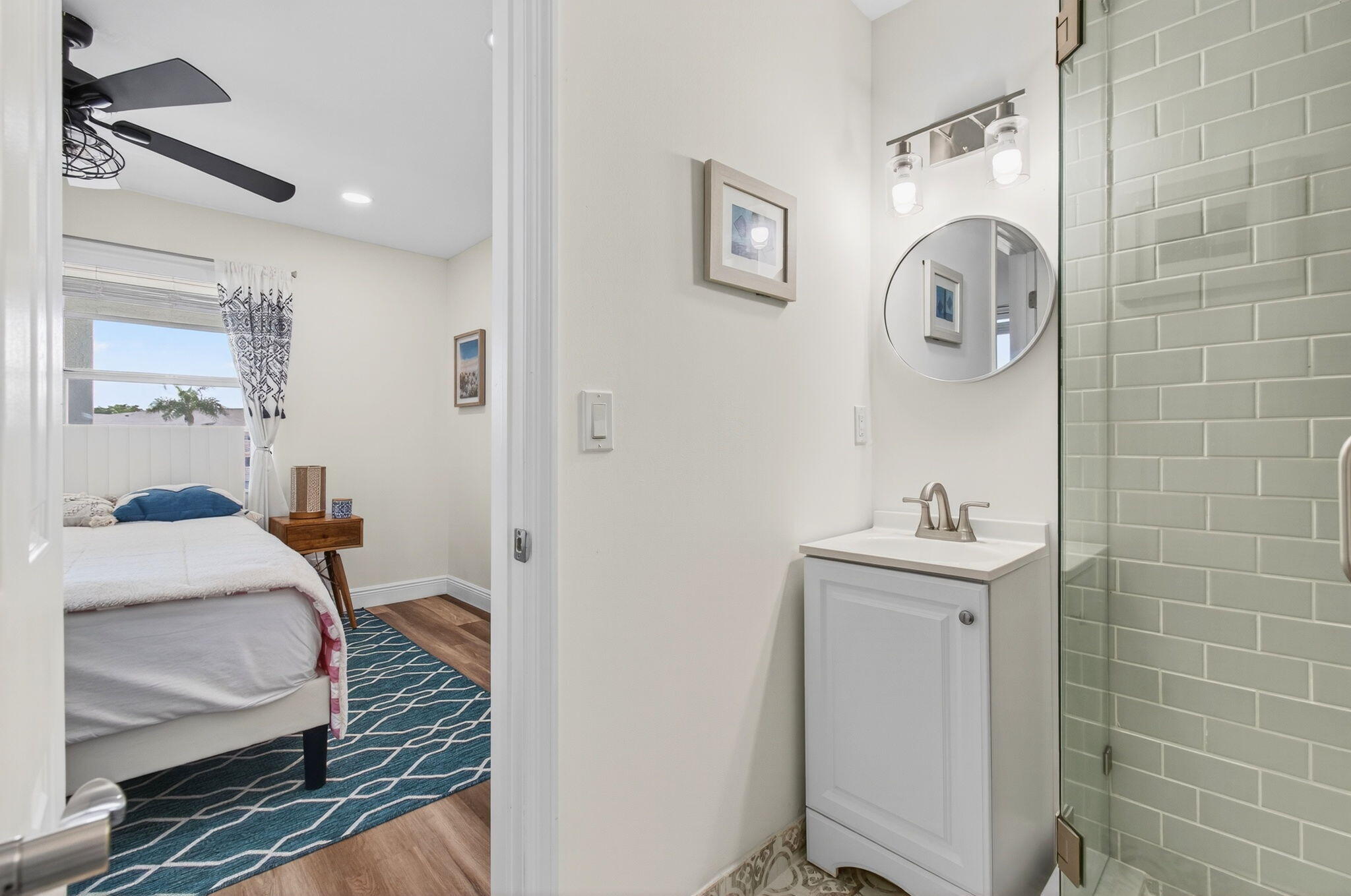 2825 Southwest 13th Street, Unit 204 Delray Beach, FL 33445 - Photo 40 of 62 a bathroom with a sink and a mirror
