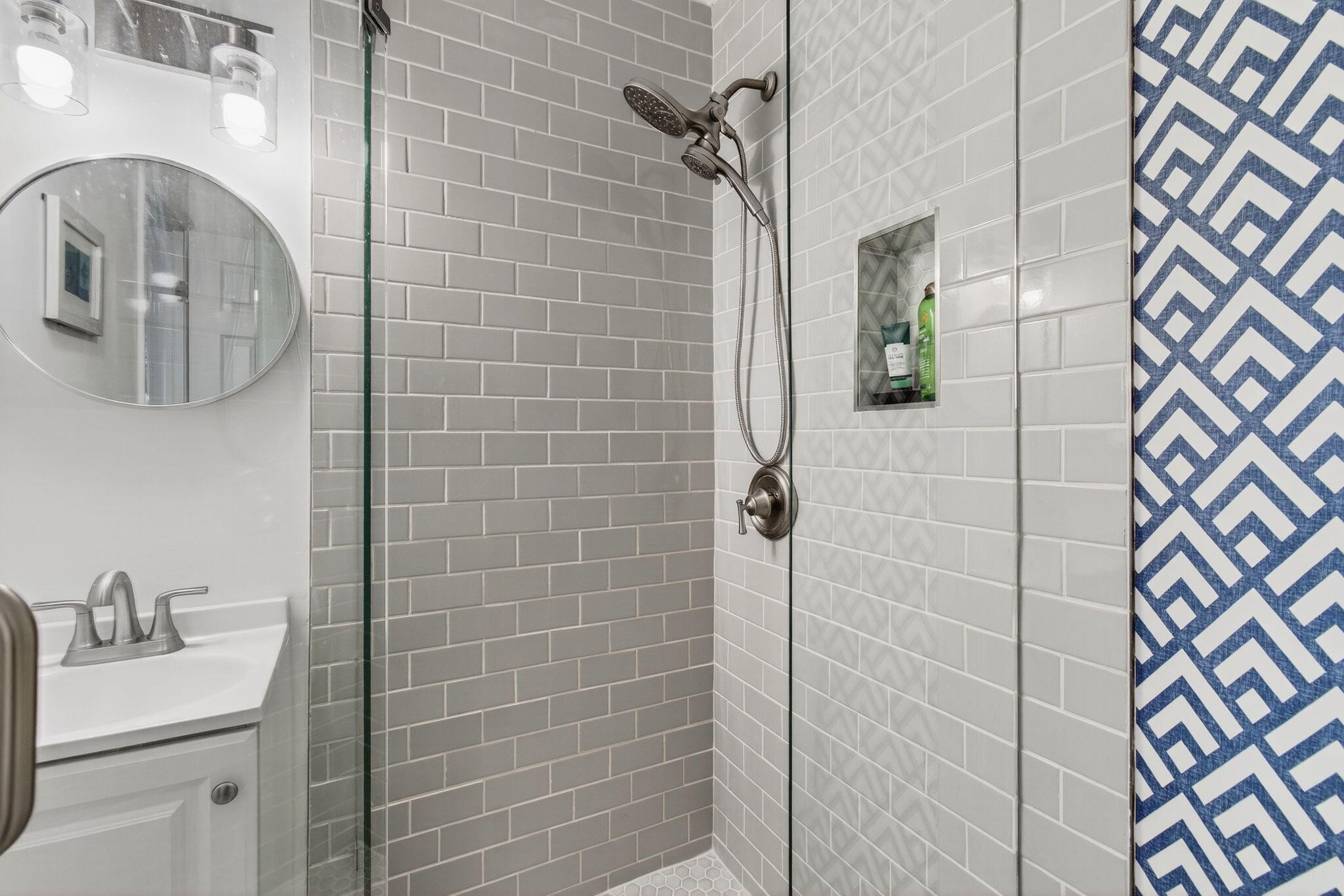 2825 Southwest 13th Street, Unit 204 Delray Beach, FL 33445 - Photo 41 of 62 a bathroom with a sink and mirror