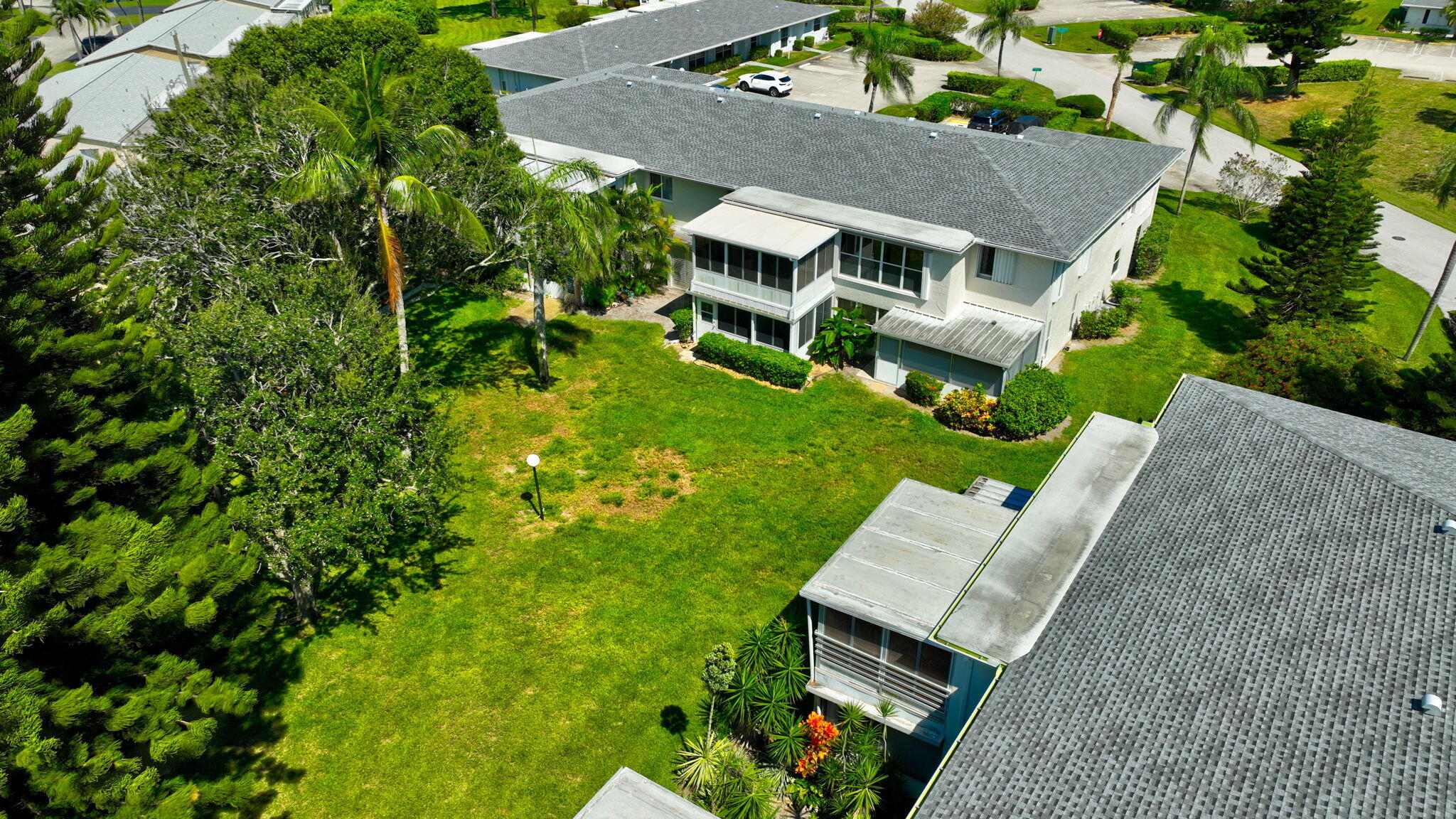 2825 Southwest 13th Street, Unit 204 Delray Beach, FL 33445 - Photo 49 of 62 an aerial view of a house with a garden
