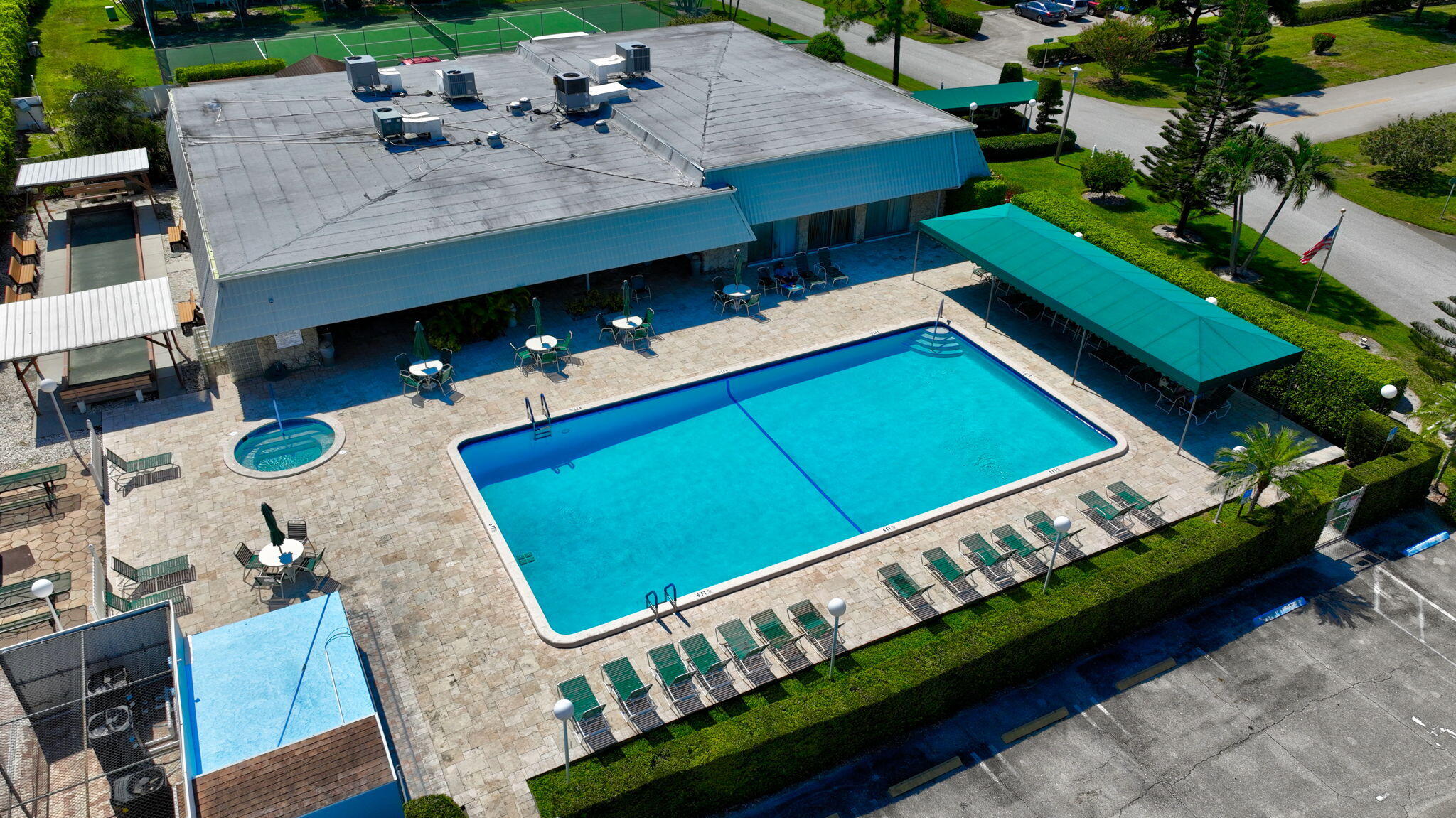 2825 Southwest 13th Street, Unit 204 Delray Beach, FL 33445 - Photo 51 of 62 an aerial view of a house with a swimming pool patio and outdoor seating