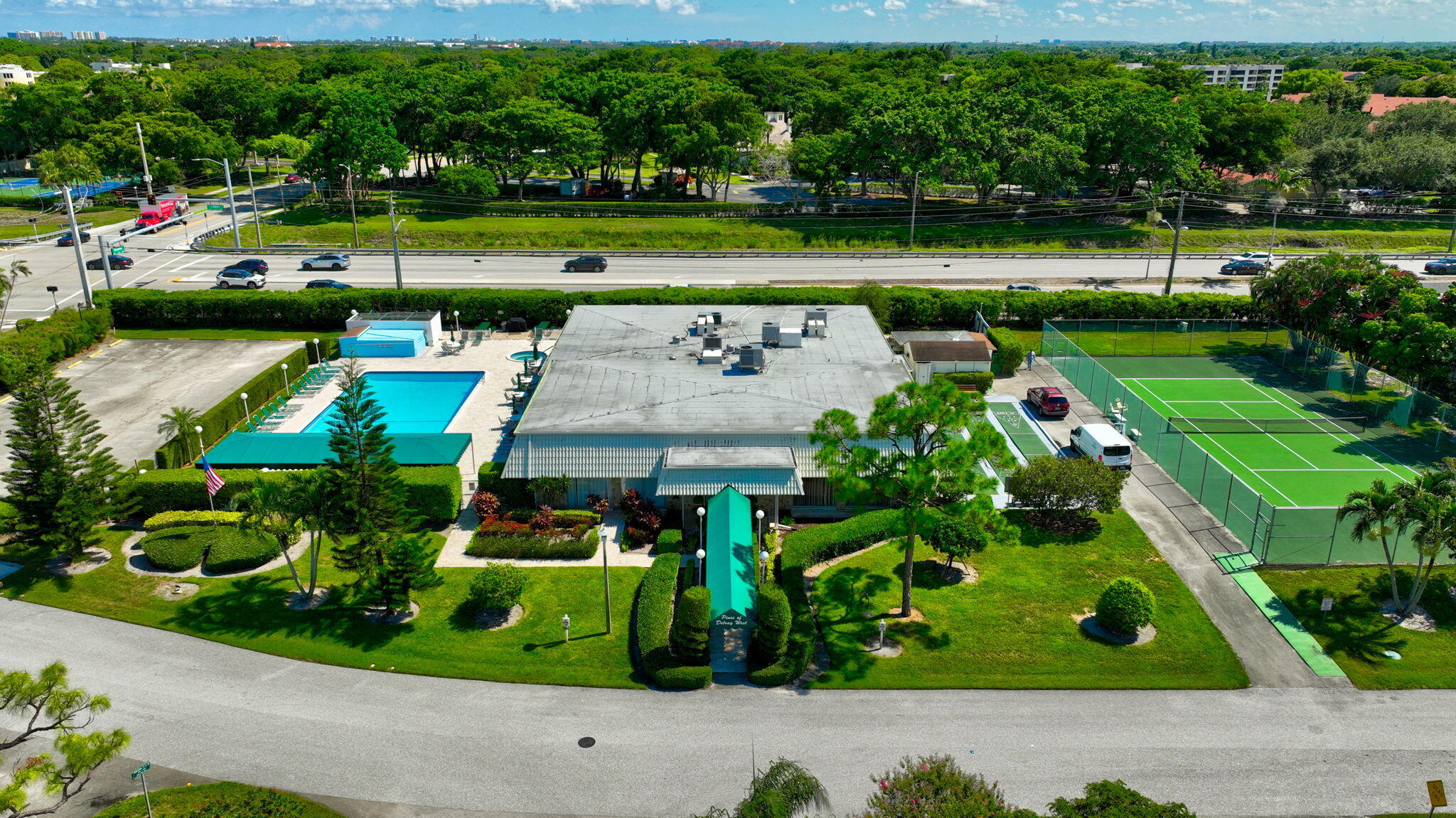 2825 Southwest 13th Street, Unit 204 Delray Beach, FL 33445 - Photo 53 of 62 a view of a park with plants and large trees