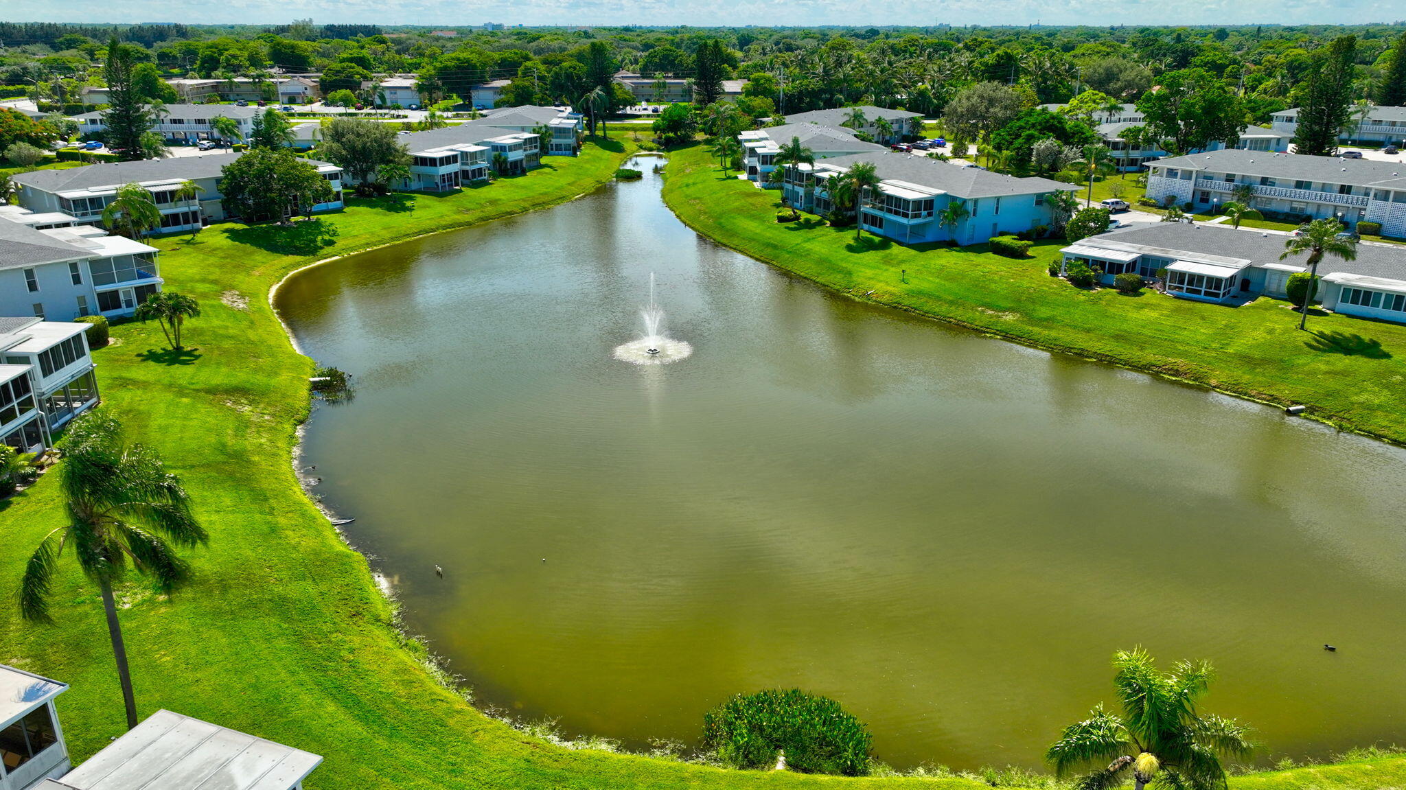 2825 Southwest 13th Street, Unit 204 Delray Beach, FL 33445 - Photo 54 of 62 a view of a lake with a city