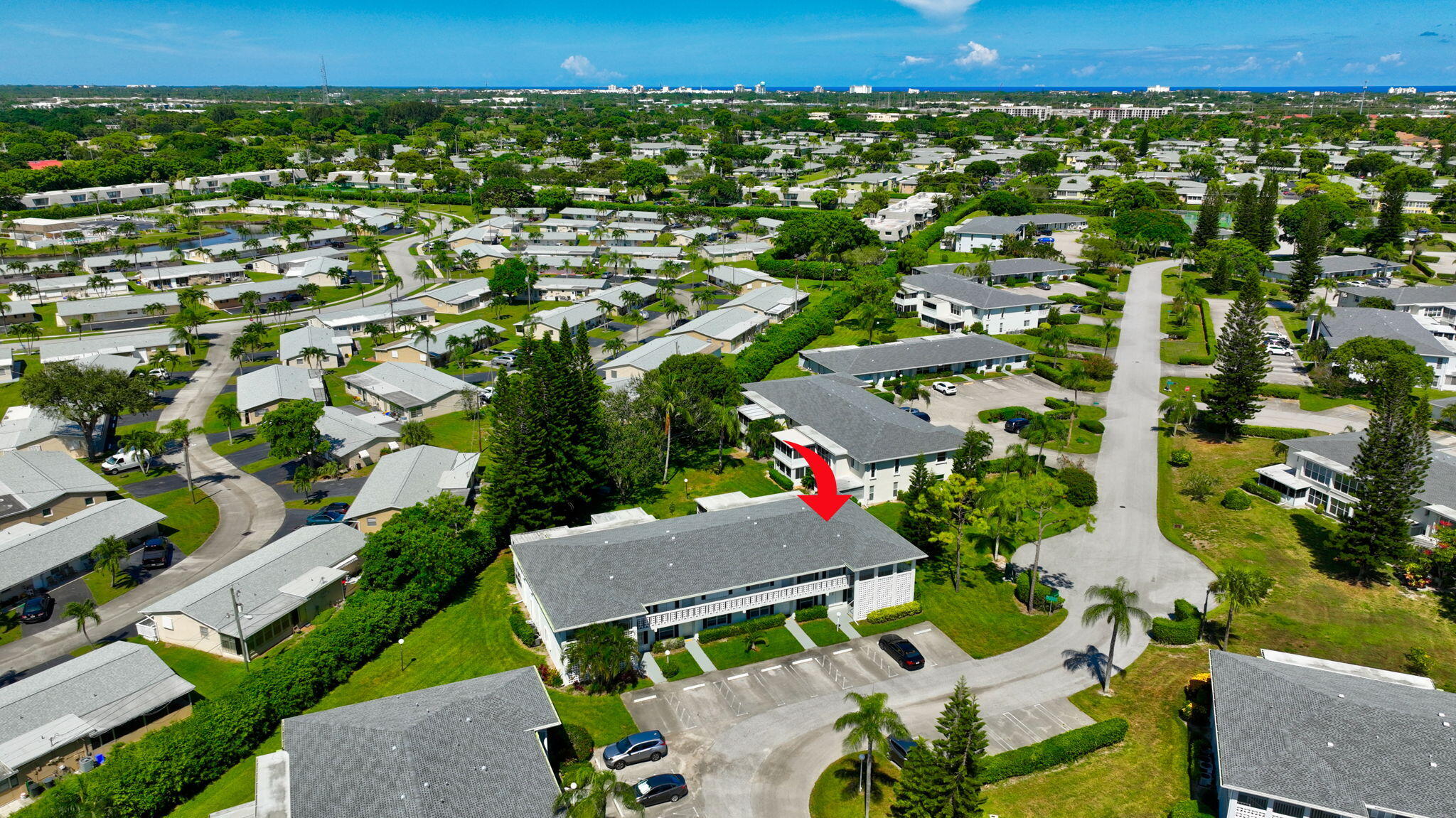 2825 Southwest 13th Street, Unit 204 Delray Beach, FL 33445 - Photo 57 of 62 an aerial view of a house with a yard