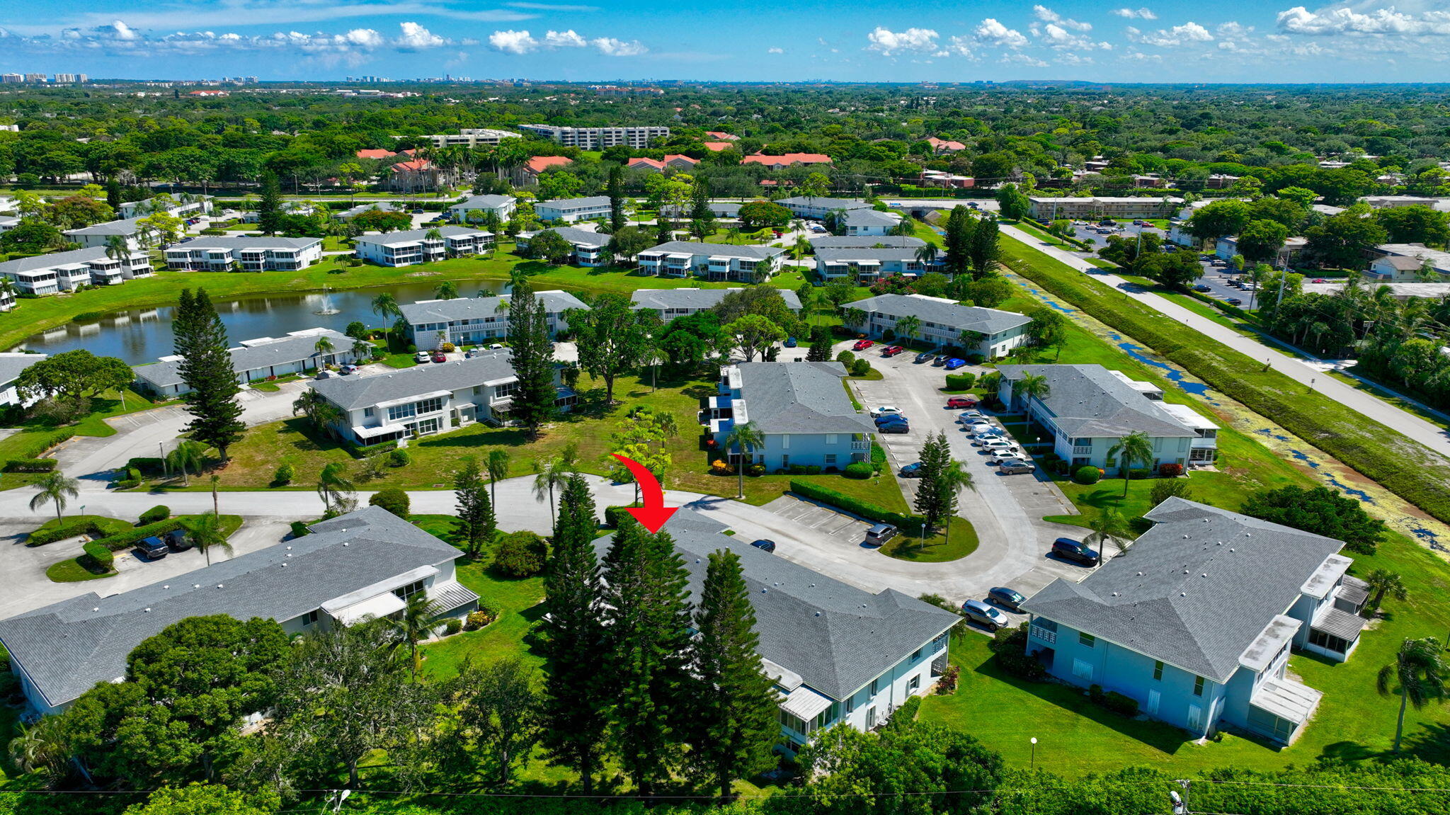 2825 Southwest 13th Street, Unit 204 Delray Beach, FL 33445 - Photo 62 of 62 an aerial view of house with yard swimming pool and outdoor seating
