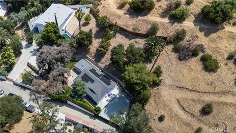 an aerial view of house with yard