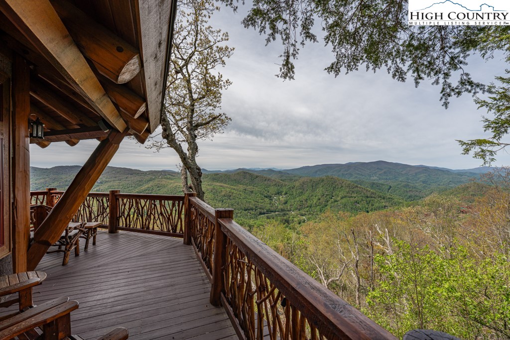 77 Eagles Nest Trail Banner Elk, NC 28604 - Photo 32 of 44 a view of a balcony with wooden floor and fence