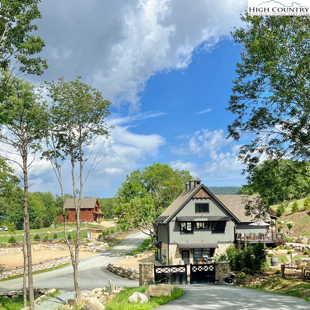 77 Eagles Nest Trail Banner Elk, NC 28604 - Photo 39 of 44 a house with trees in the background