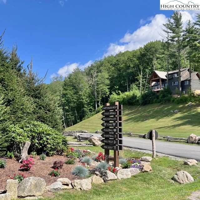 77 Eagles Nest Trail Banner Elk, NC 28604 - Photo 42 of 44 a view of a garden with a bench in the garden