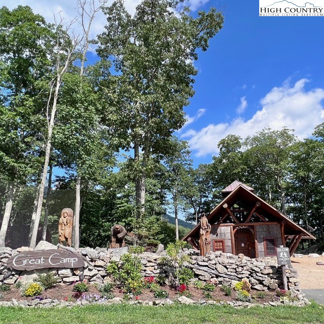 77 Eagles Nest Trail Banner Elk, NC 28604 - Photo 43 of 44 a front view of a house with garden