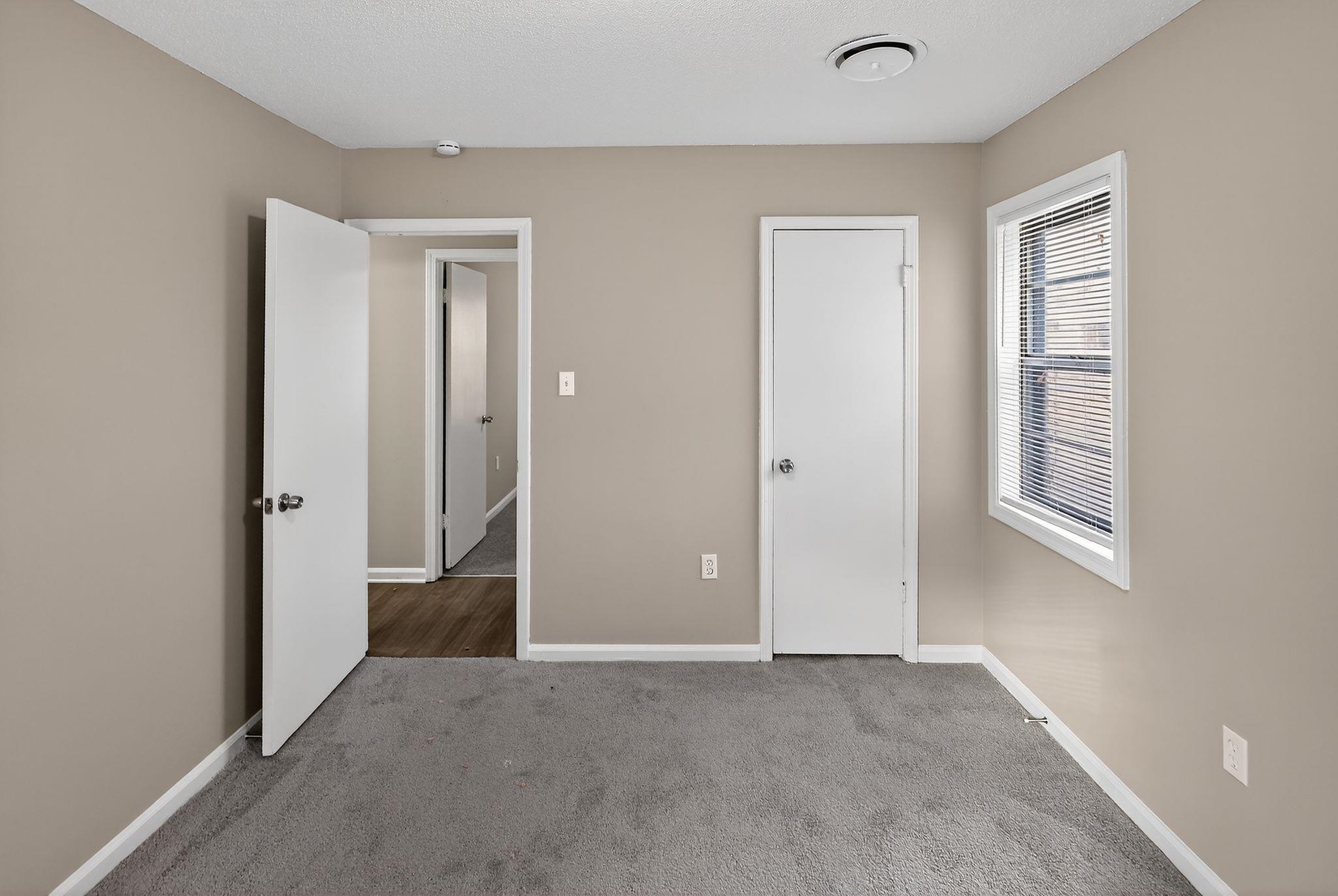 3860 Castleman Street Memphis, TN 38118 - Photo 24 of 30 a view of an empty room with windows and closet