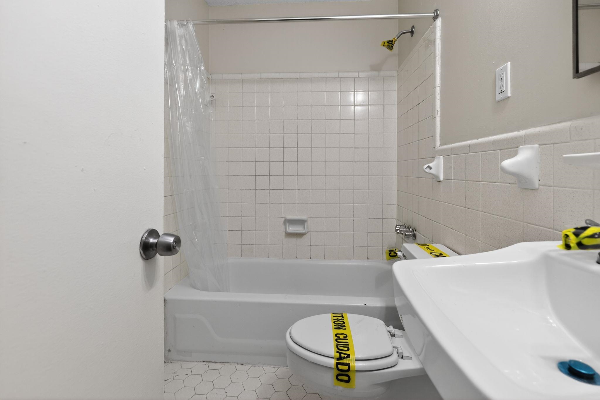 3860 Castleman Street Memphis, TN 38118 - Photo 28 of 30 a bathroom with a sink and a bathtub