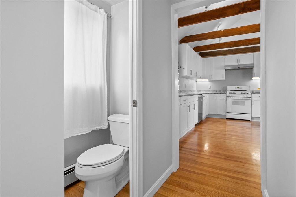 89 Prospect Street Somerville, MA 02143 - Photo 12 of 21 a bathroom with a sink a toilet and view
