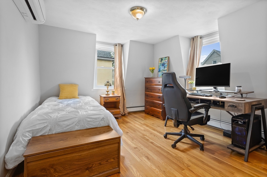 89 Prospect Street Somerville, MA 02143 - Photo 14 of 21 a bedroom with a workspace