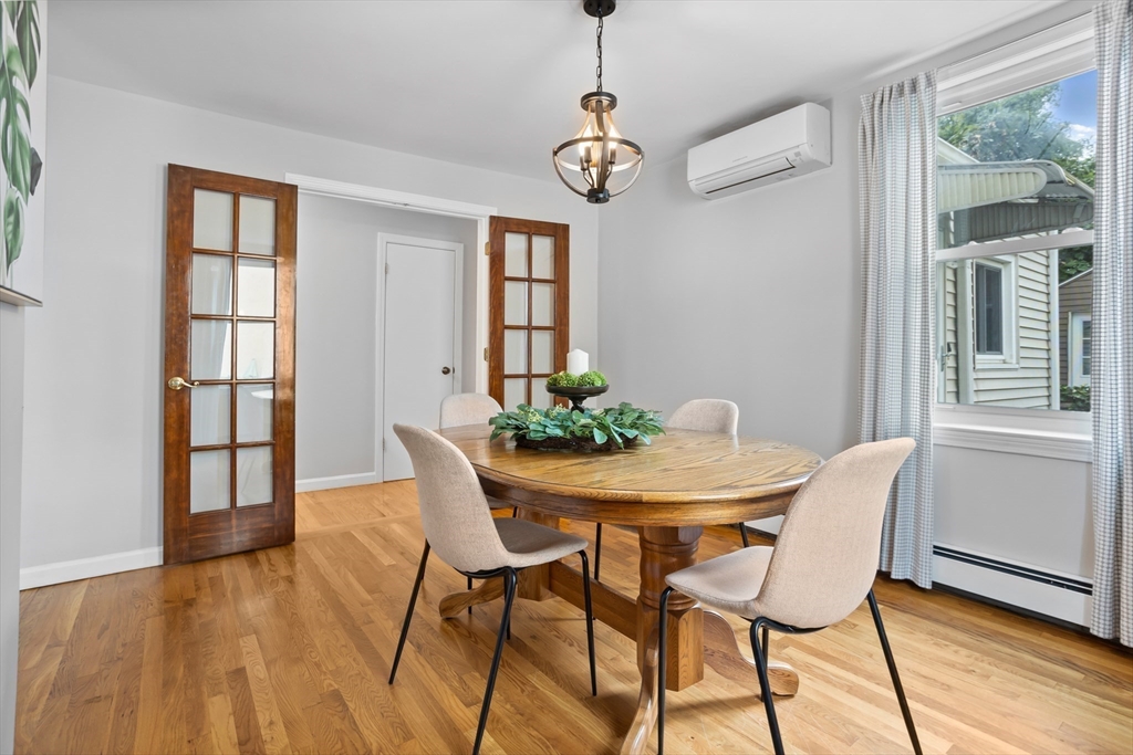 89 Prospect Street Somerville, MA 02143 - Photo 6 of 21 a view of a dining room with furniture window and wooden floor