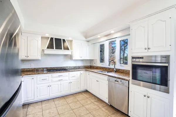 a kitchen with a refrigerator a sink and dishwasher