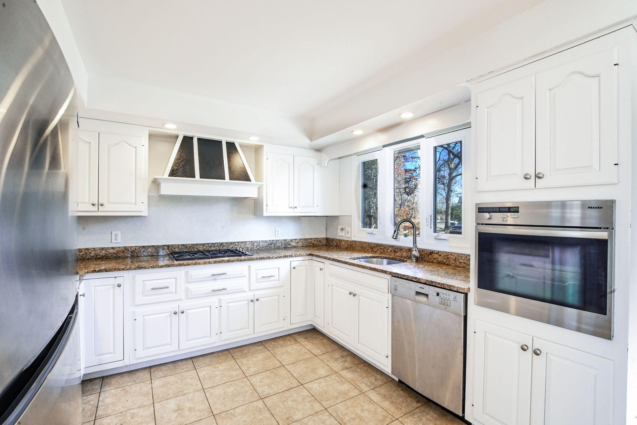 5 Rivers View Road East Falmouth, MA 02536 - Photo 23 of 44 a kitchen with granite countertop a sink and cabinets