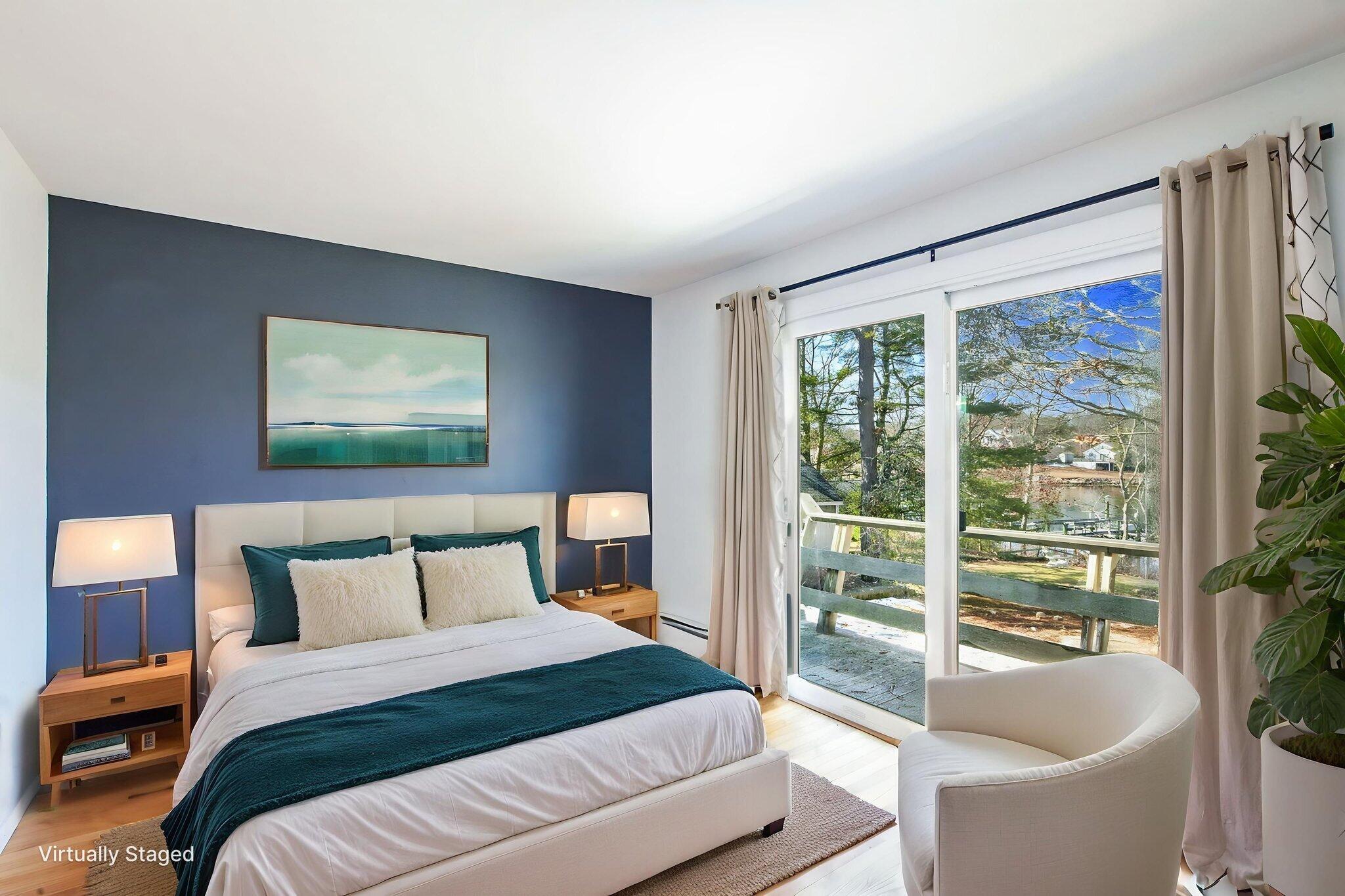 5 Rivers View Road East Falmouth, MA 02536 - Photo 27 of 44 a bedroom with a large bed and a large window