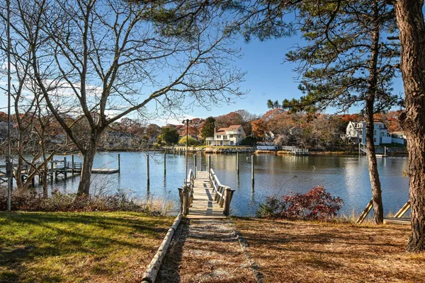 a view of a lake with a house in the background