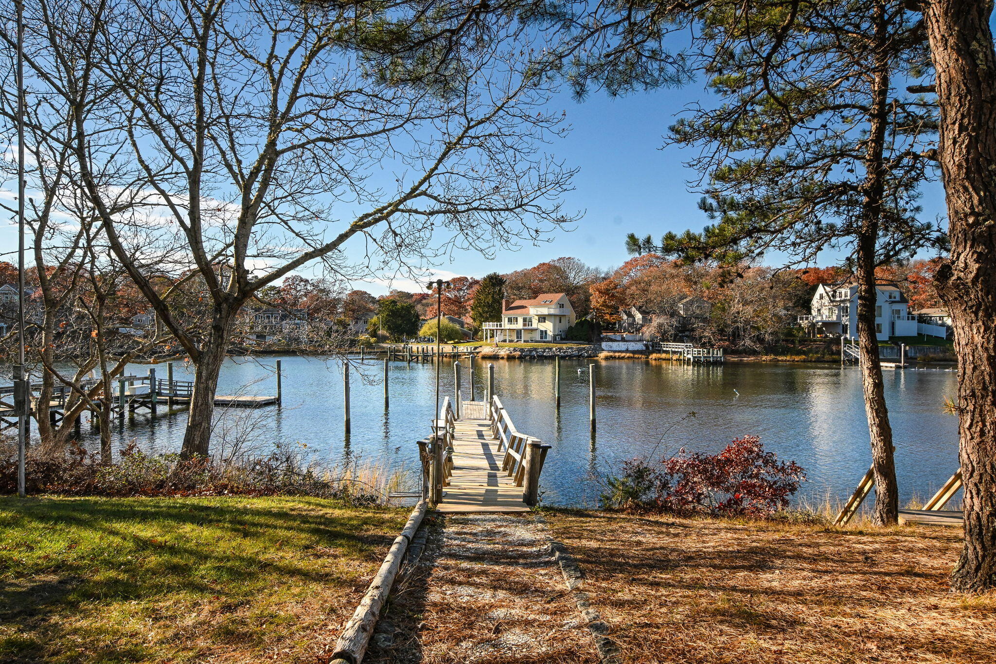 5 Rivers View Road East Falmouth, MA 02536 - Photo 3 of 44 a view of a lake with a house in the background