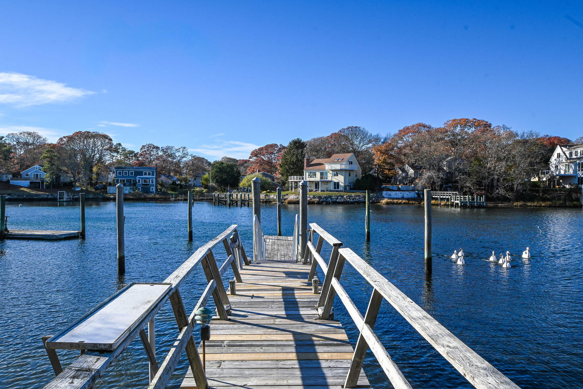 5 Rivers View Road East Falmouth, MA 02536 - Photo 5 of 44 a view of a balcony with chairs