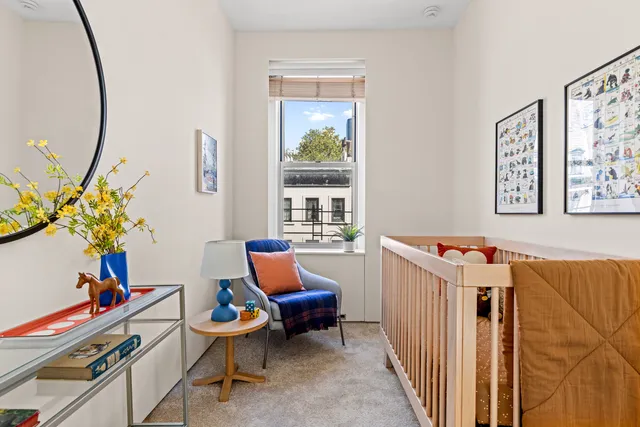 a dining room with a table and chairs