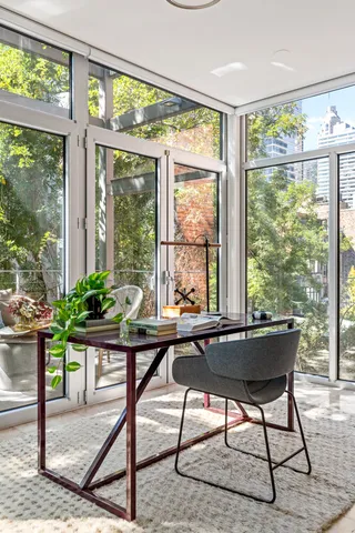 a dining room with furniture and window