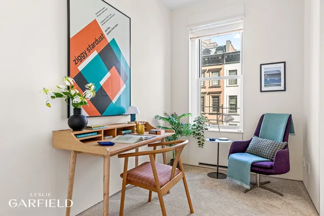 a view of a workspace with furniture