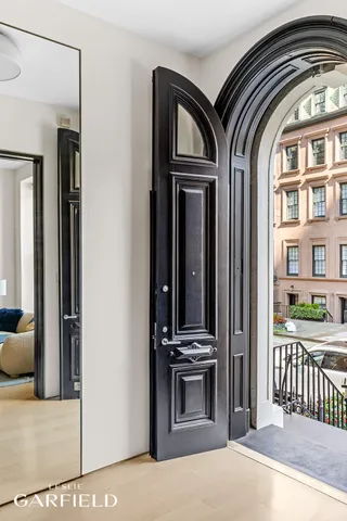 a view of front door and bedroom