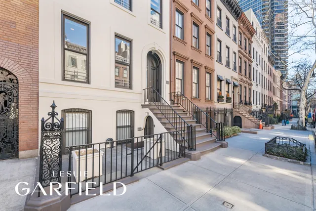 a view of a brick building with many windows
