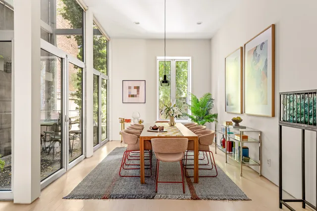 a dining room with furniture and wooden floor