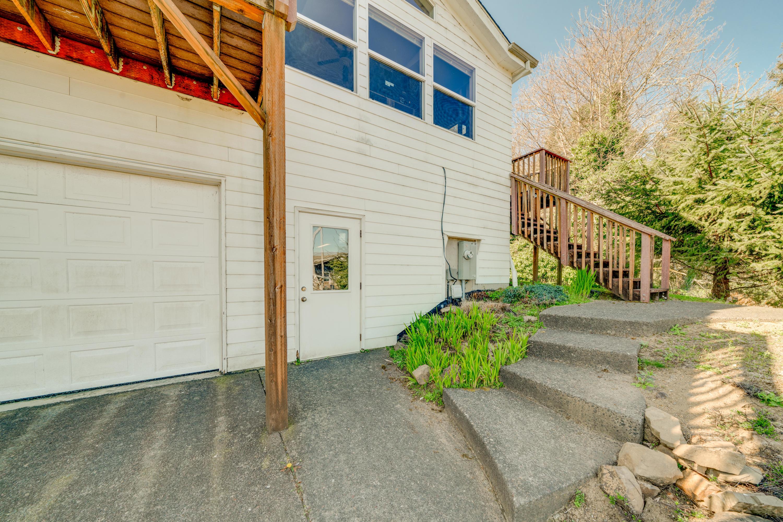 178 South River View Street Wheeler, OR 97147 - Photo 17 of 32 Steps to upper level deck off of kitchen