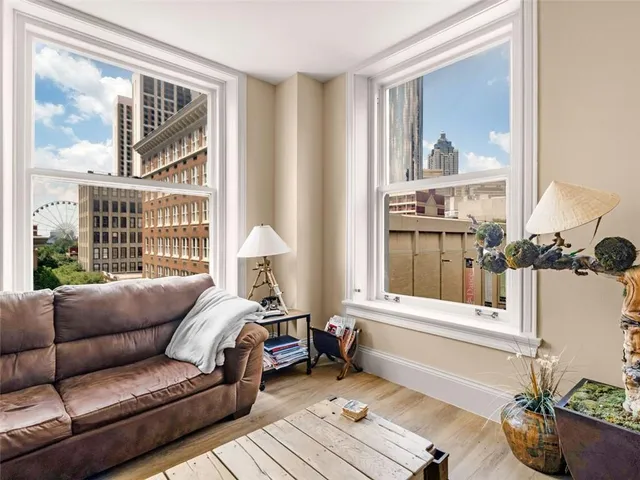 a living room with furniture and a window