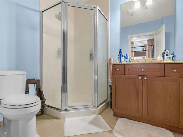 a bathroom with a toilet and a mirror