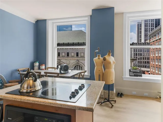 a kitchen with a sink cabinets and window