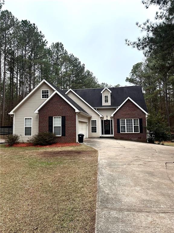1526 Klopfer Road Juliette, GA 31046 - Photo 1 of 1 a front view of house with yard and trees