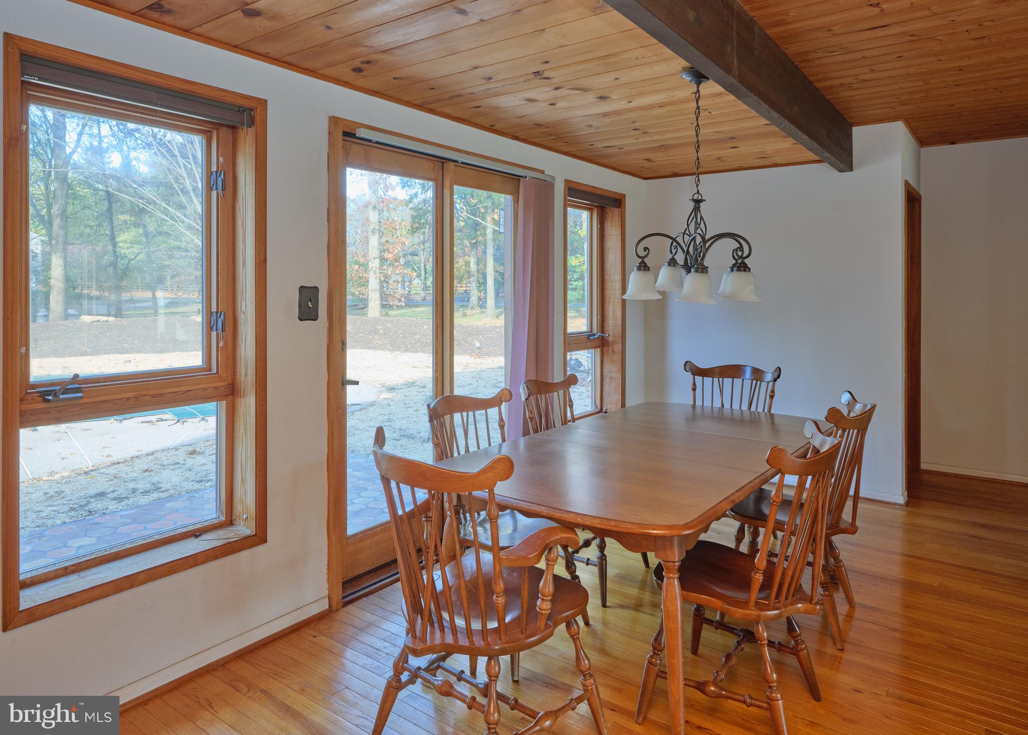 2999 Comfort Road New Hope, PA 18938 - Photo 13 of 40 a dining room with furniture large windows and wooden floor
