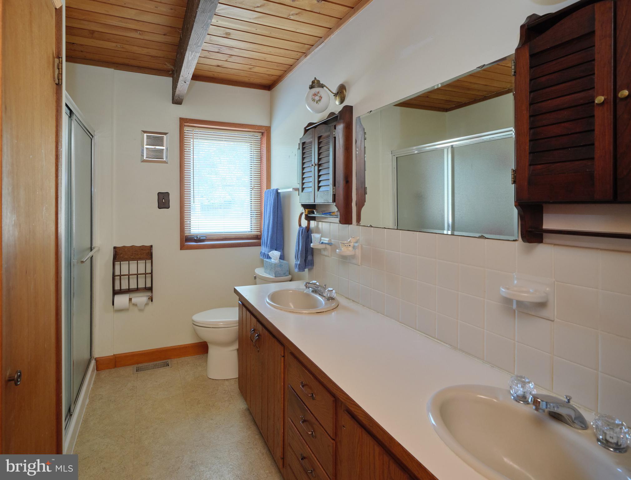 2999 Comfort Road New Hope, PA 18938 - Photo 16 of 40 a bathroom with a sink double vanity and a toilet