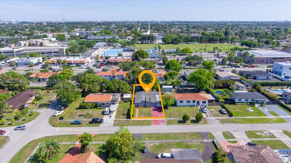 120 West 50th Street Hialeah, FL 33012 - Photo 5 of 22 a view of multiple houses with a swimming pool