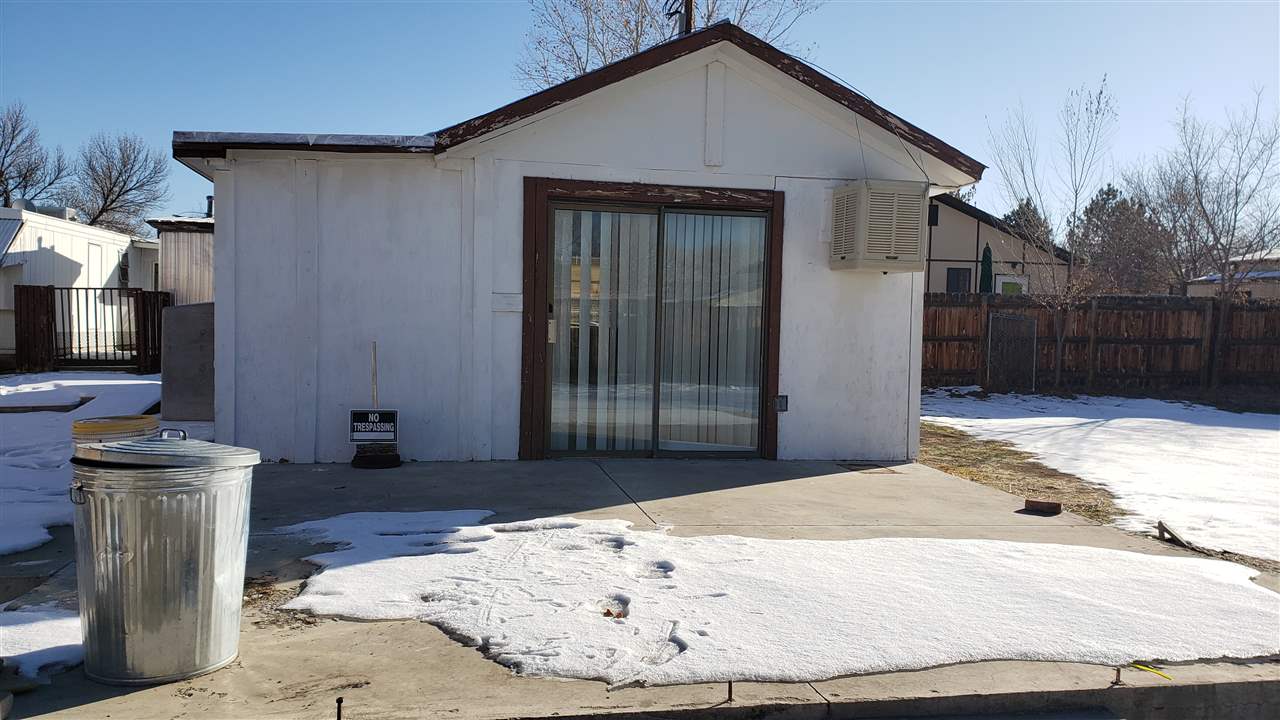 2877 B Road Grand Junction, CO 81503 - Photo 1 of 14 a view of a house with a wooden fence
