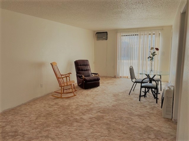 2877 B Road Grand Junction, CO 81503 - Photo 12 of 14 a living room with furniture a table and a window