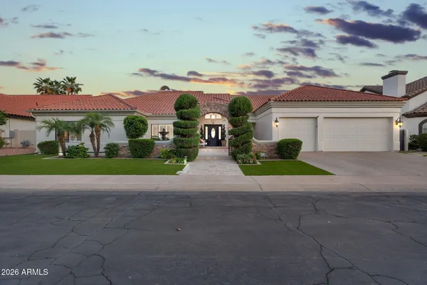 a view of house with outdoor space and parking