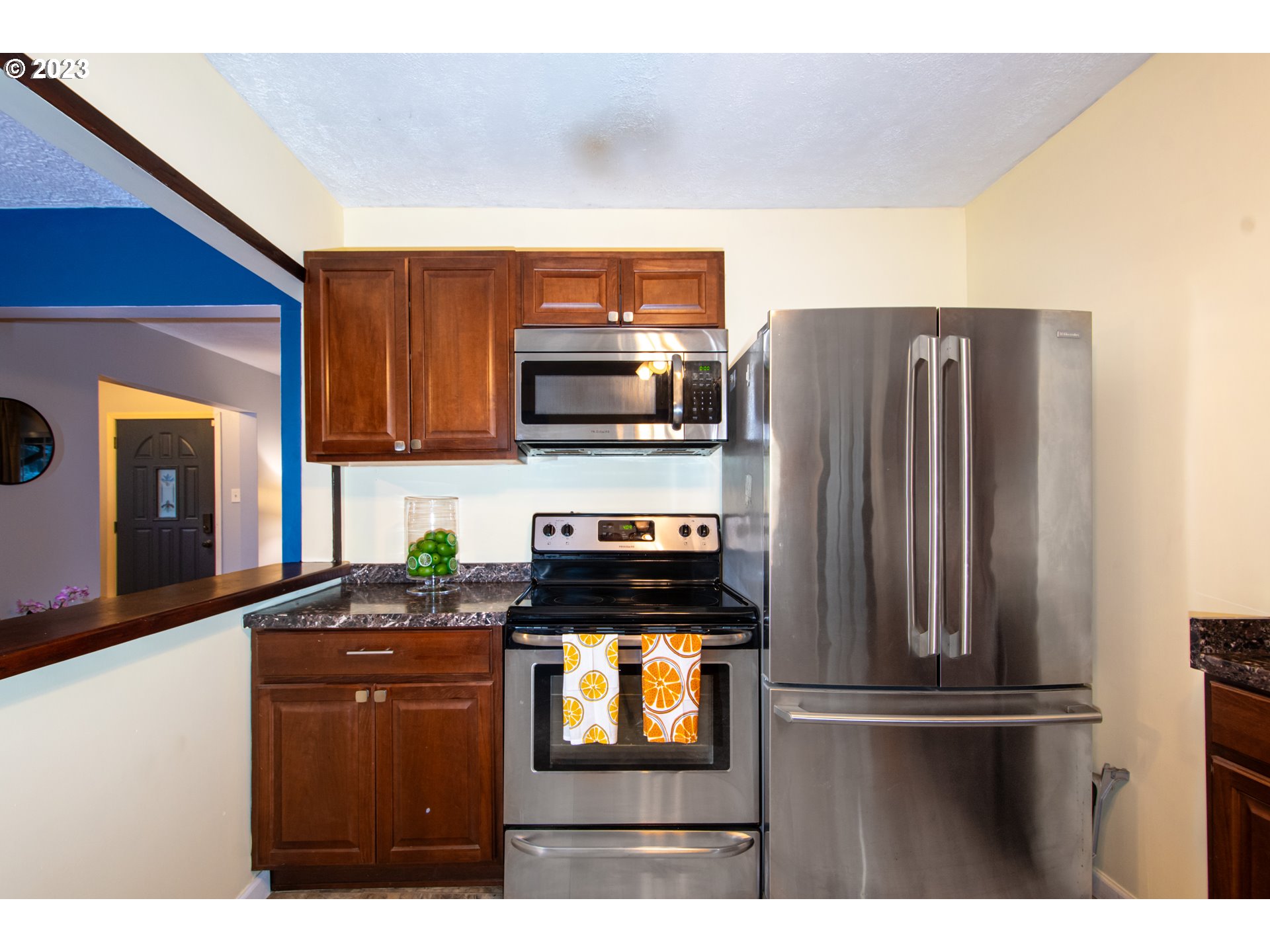 2818 Field Street Longview, WA 98632 - Photo 13 of 34 a kitchen with stainless steel appliances granite countertop a refrigerator stove and microwave
