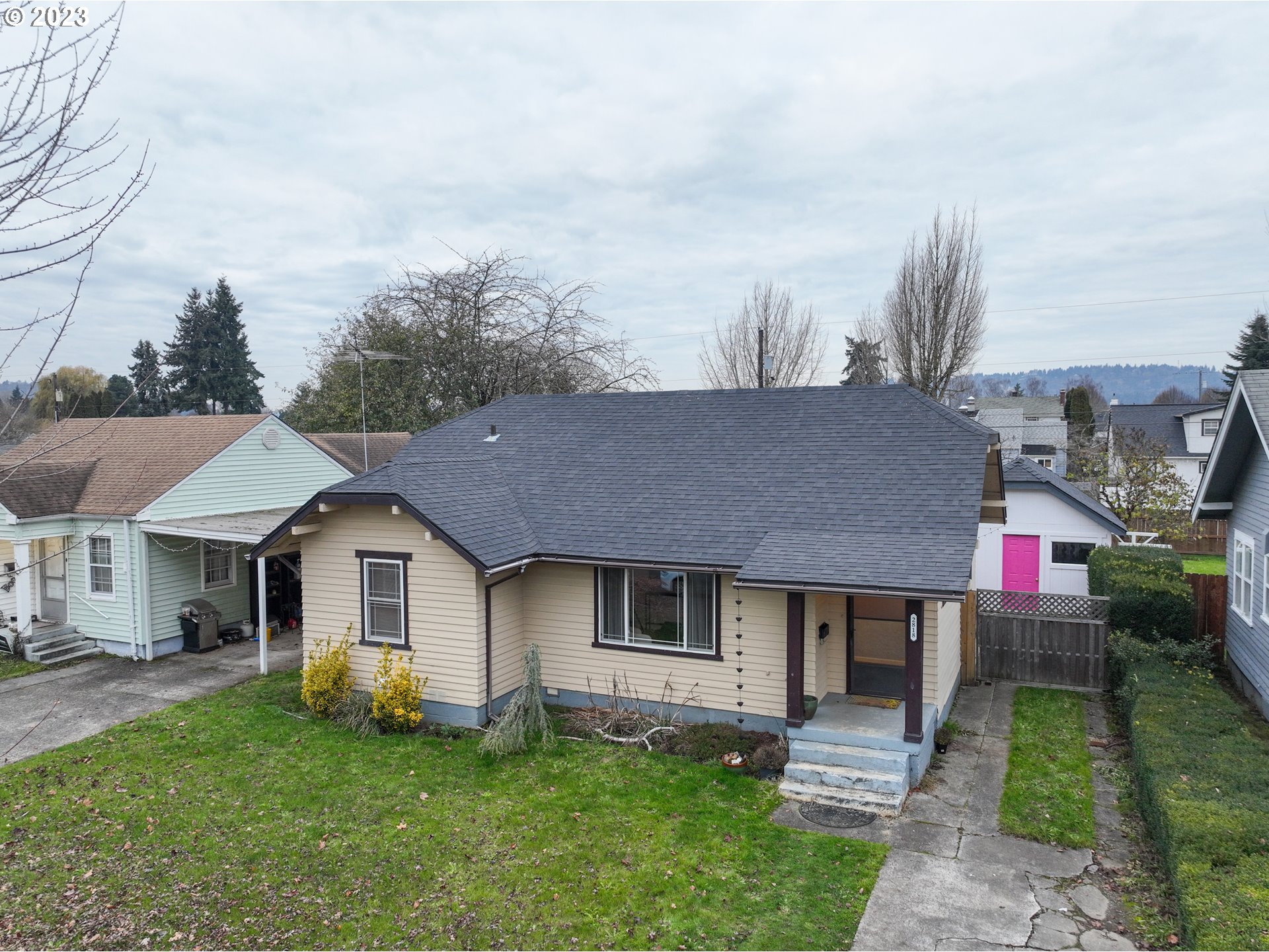2818 Field Street Longview, WA 98632 - Photo 2 of 34 a front view of a house with a garden and trees