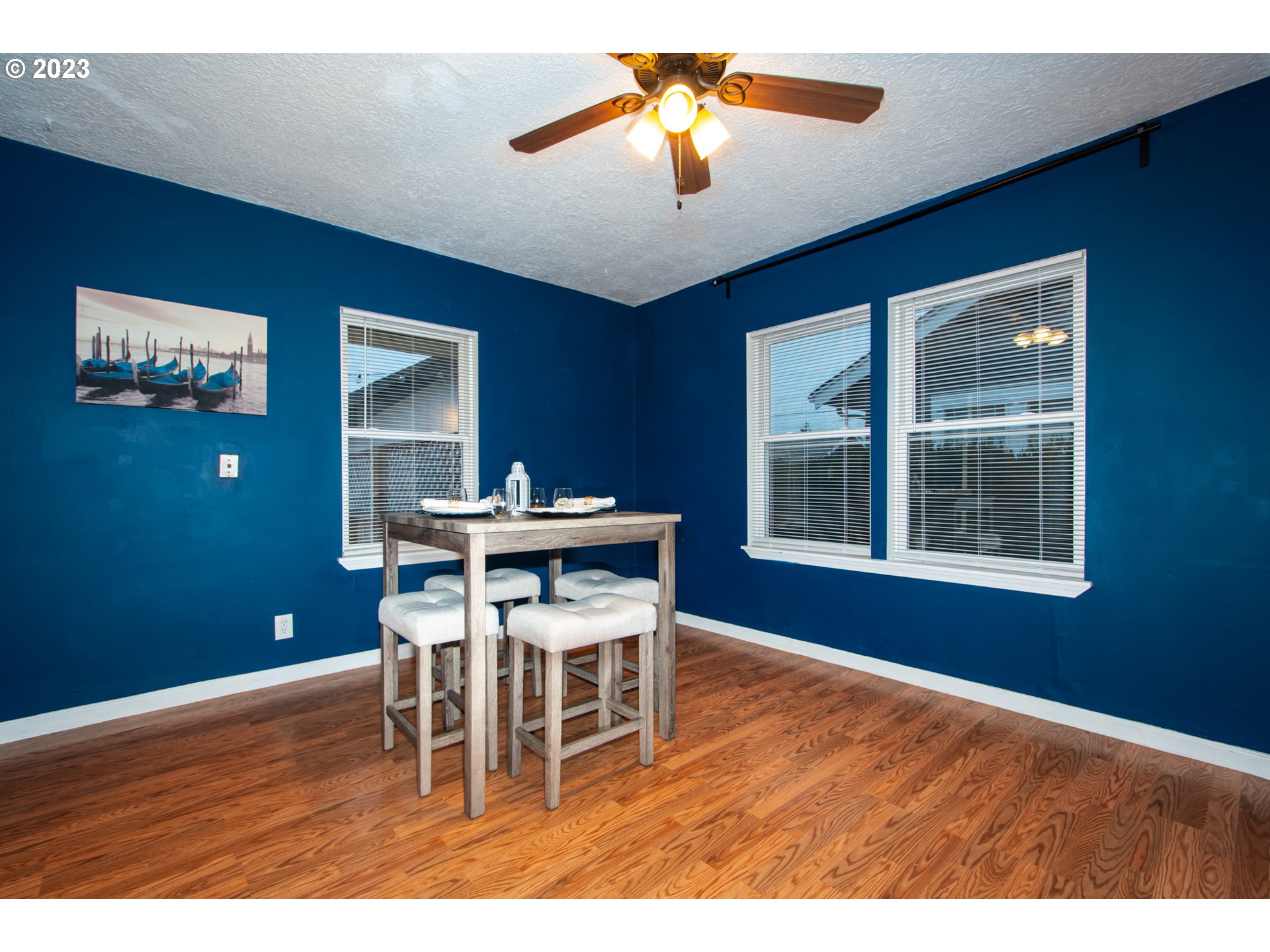 2818 Field Street Longview, WA 98632 - Photo 9 of 34 a dining room with furniture a chandelier and wooden floor