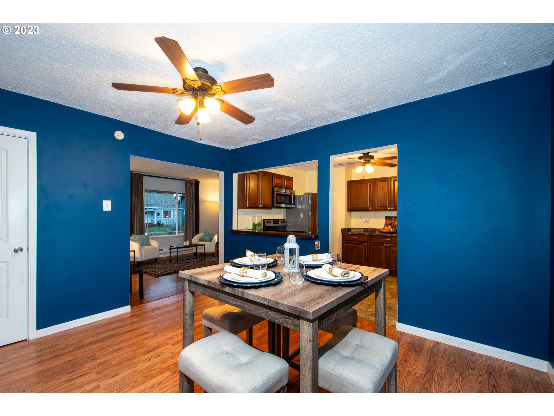 2818 Field Street Longview, WA 98632 - Photo 10 of 34 a view of a dining room with furniture window and wooden floor