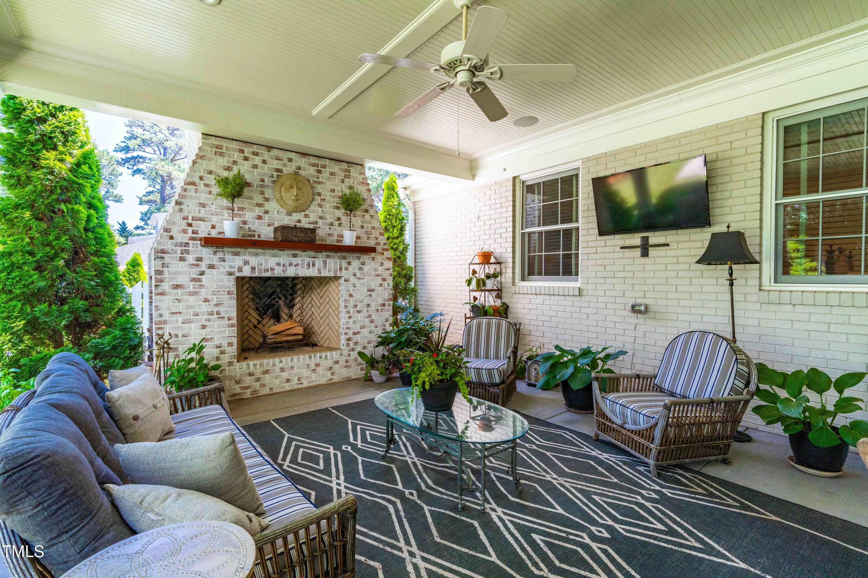 1409 Dellwood Drive Raleigh, NC 27607 - Photo 54 of 59 a outdoor space with furniture and a fireplace
