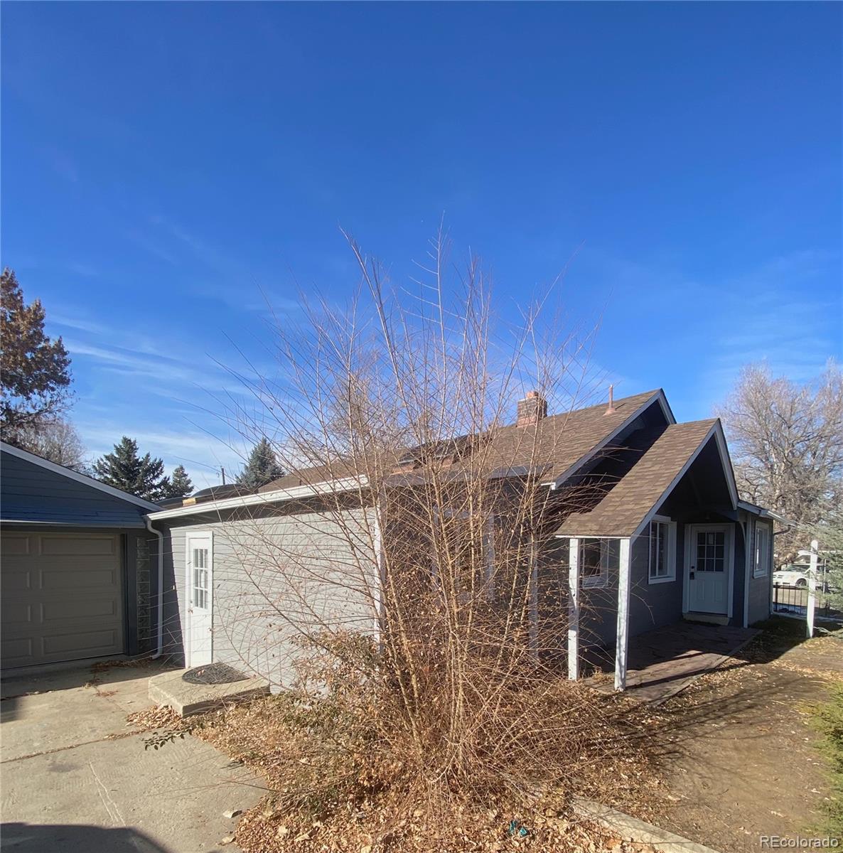 4315 Balsam Street, Unit A Wheat Ridge, CO 80033 - Photo 1 of 21 a view of a house with a yard