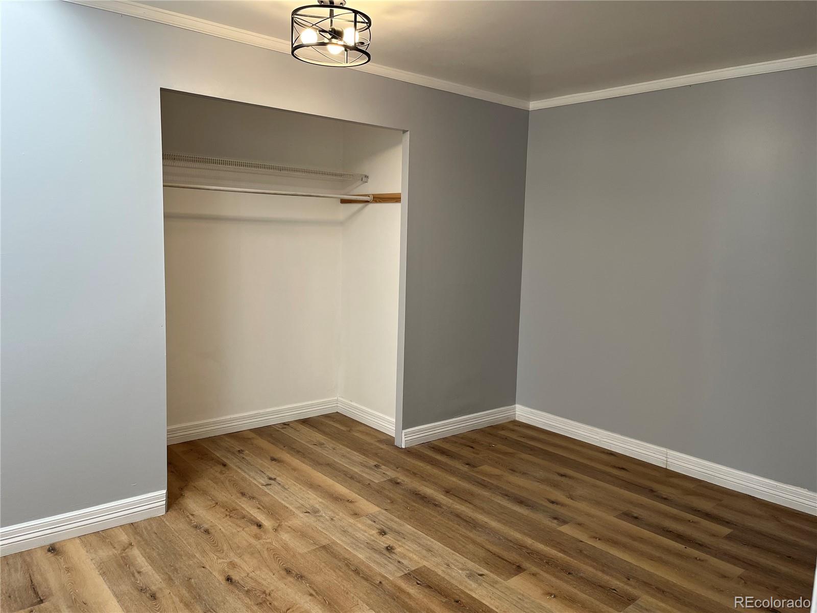 4315 Balsam Street, Unit A Wheat Ridge, CO 80033 - Photo 12 of 21 a view of an empty room with wooden floor