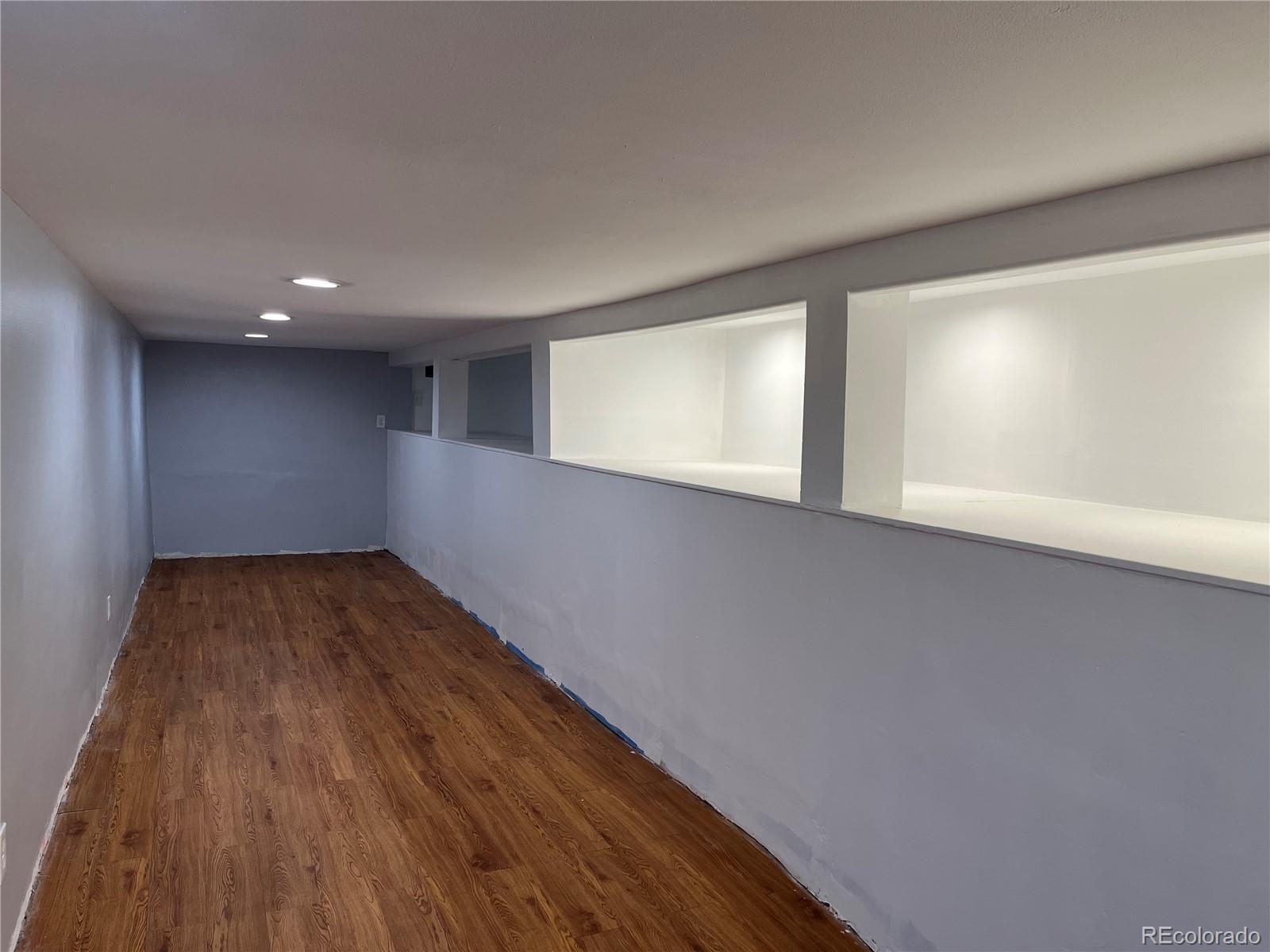 4315 Balsam Street, Unit A Wheat Ridge, CO 80033 - Photo 14 of 21 a view of empty room with wooden floor