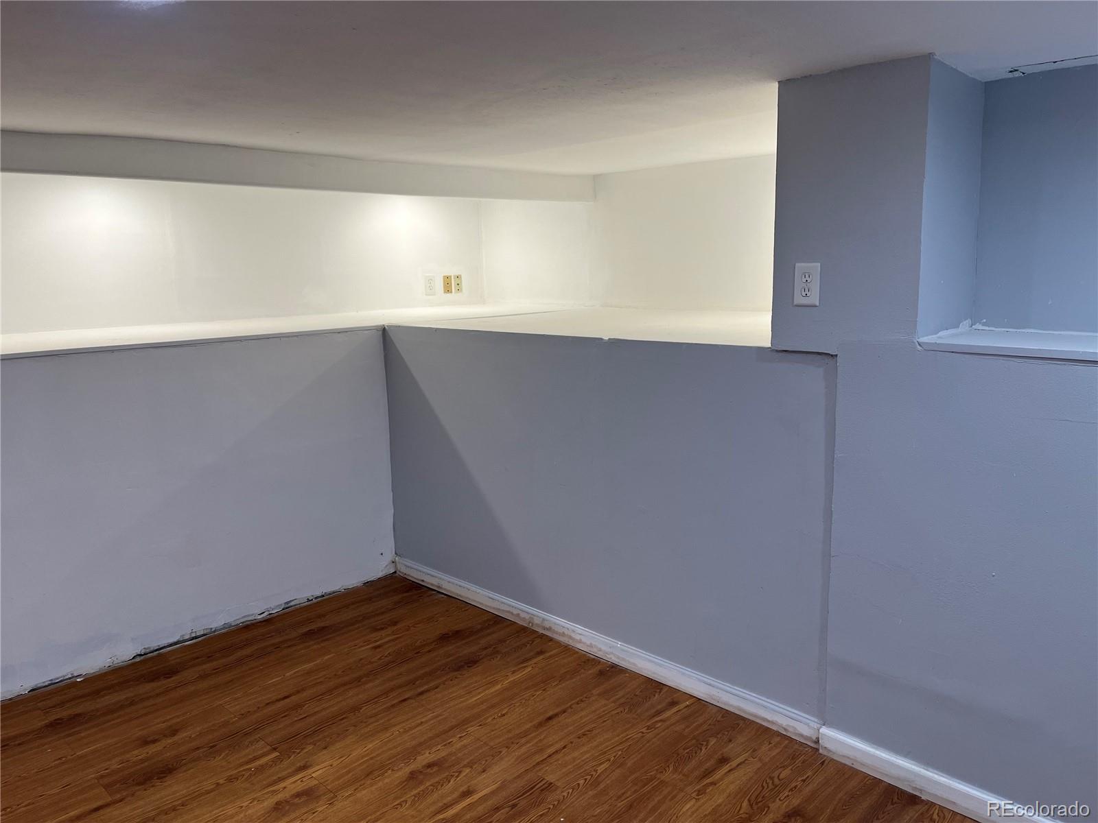 4315 Balsam Street, Unit A Wheat Ridge, CO 80033 - Photo 15 of 21 a view of an empty room with wooden floor